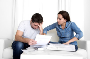 young couple worried at home in stress accounting bank payments Chapter 13 Bankruptcy