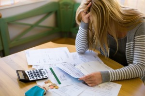 woman with debts and bills Chapter 7 Bankruptcy